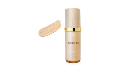 Rise Luxus 2PVP medium spectrum foundation bottle with beige makeup swatch and gold accents