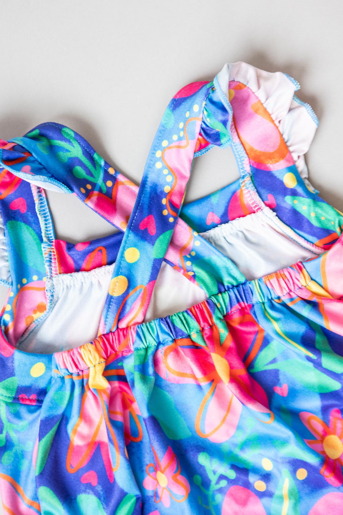 SALE Springing Around Ruffle Cross Back Romper